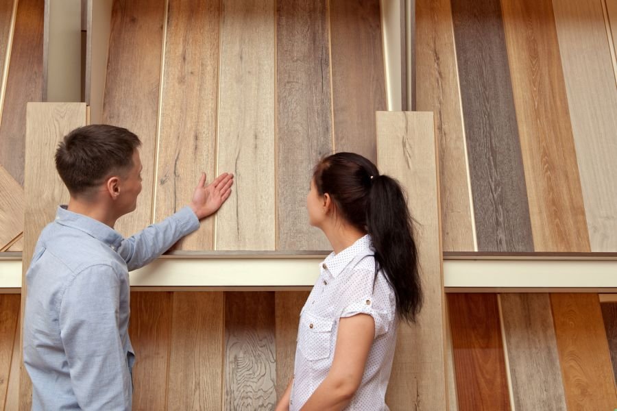 Customers examining floor products in-store